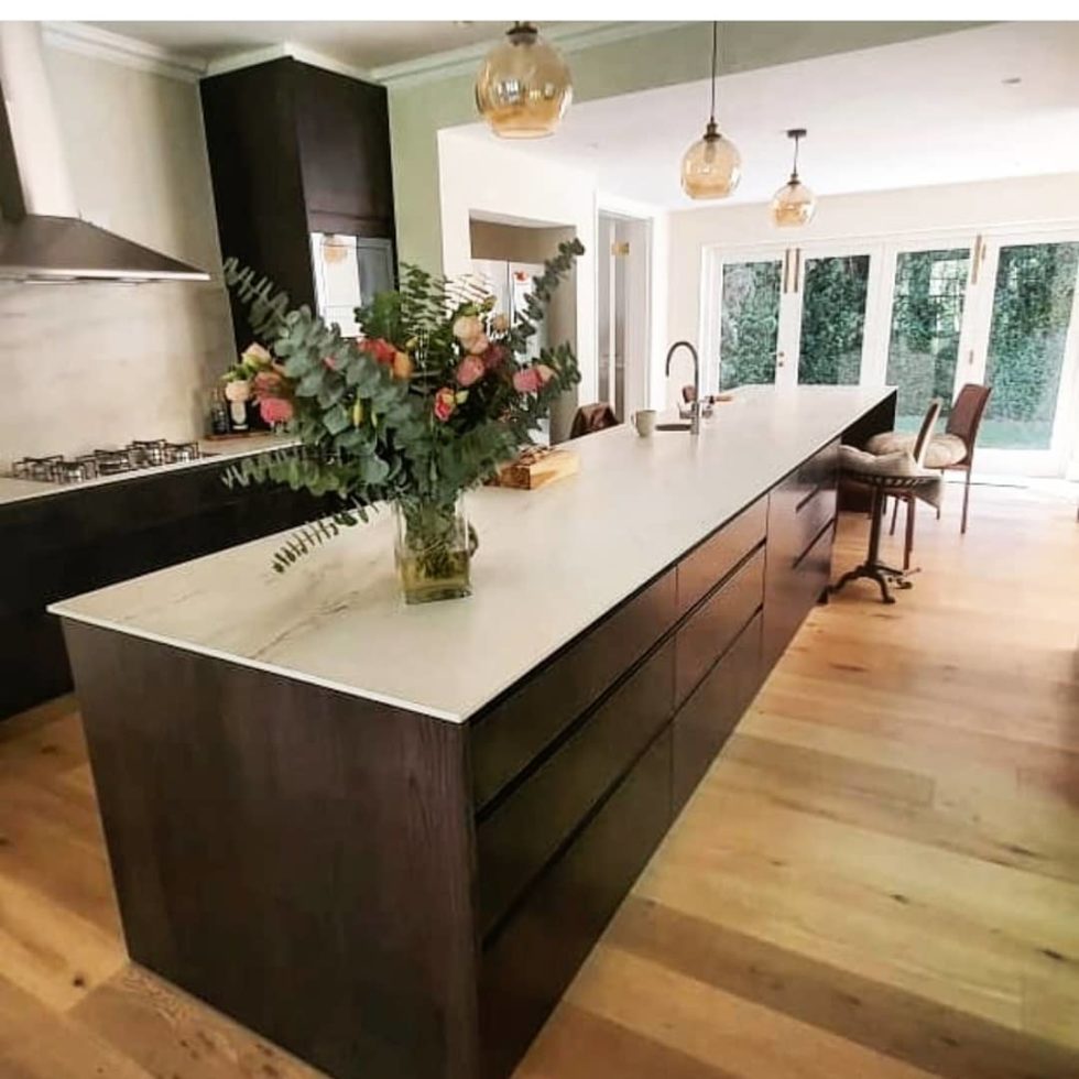White countertop on black kitchen cabinets
