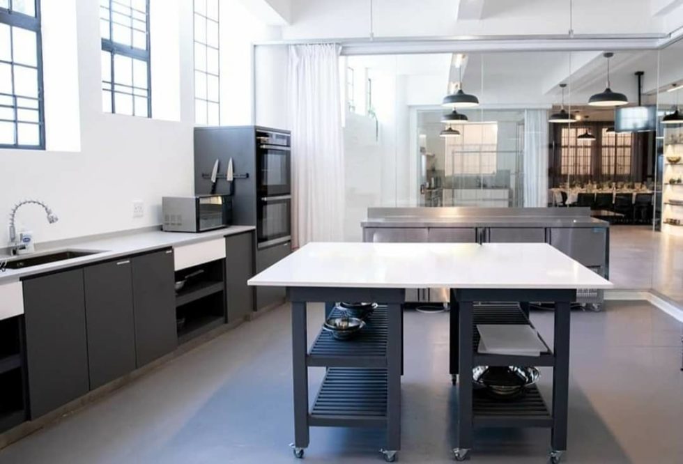 white island countertop complemented by dark grey kitchen counters