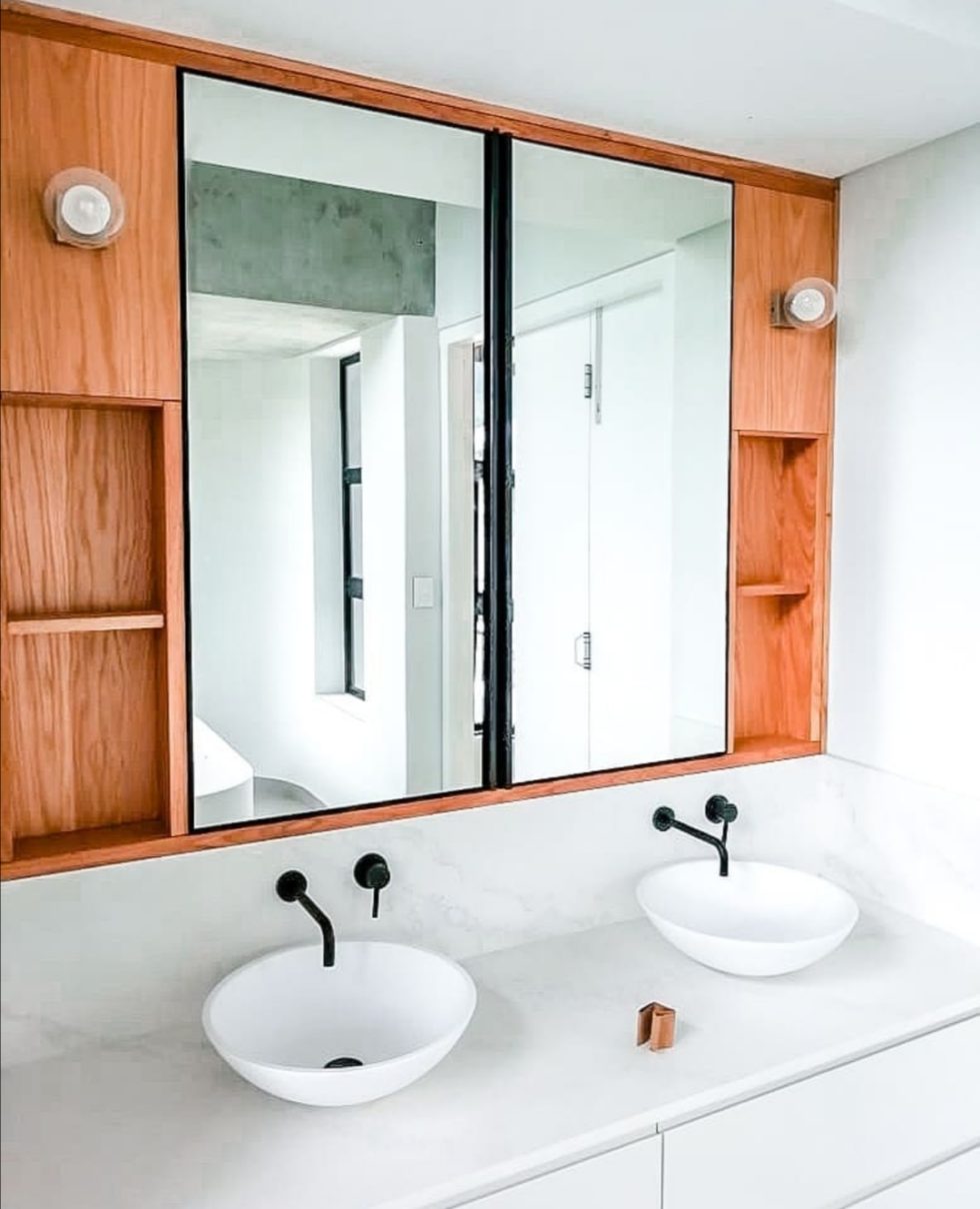 two white bathroom countertop basins
